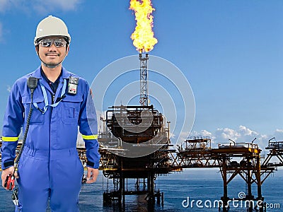 Working engineer at offshore oil and gas refinery Stock Photo