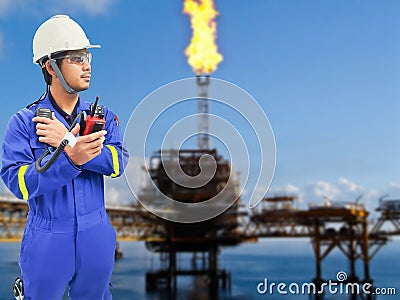 Working engineer at offshore oil and gas refinery Stock Photo