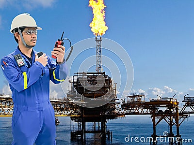 Working engineer at offshore oil and gas refinery Stock Photo