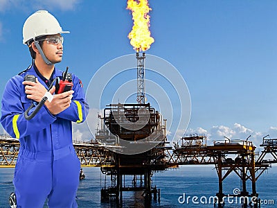 Working engineer at offshore oil and gas refinery Stock Photo