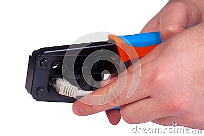 Working with ethernet and phone crimp tool Stock Photo