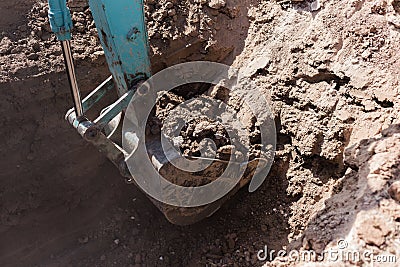 Working Excavator Tractor Digging A Trench. Stock Photo