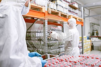 Working in Food Factory Warehouse Stock Photo