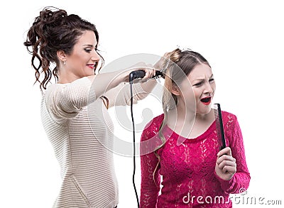 Working hairstylist and singing client Stock Photo