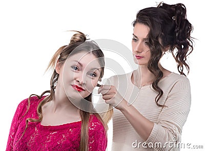 Working hairstylist and smiling woman Stock Photo