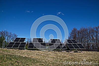 A working installation of Solar panels for sun energy production in the open air, Plana mountain Stock Photo