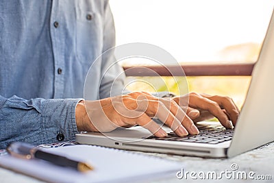 working on laptop, close up of hands of business man. Stock Photo