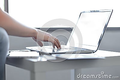 Working on laptop, close up of hands of business man Stock Photo