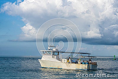 A working lobster fishing boat on the water at Key West Florida. Editorial Stock Photo