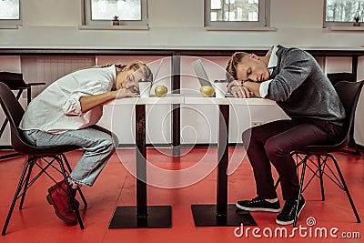 Office workers being extremely tired during active workday Stock Photo