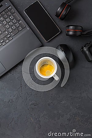 Working place and office desk with coffee, laptop, headset and smartphone Stock Photo