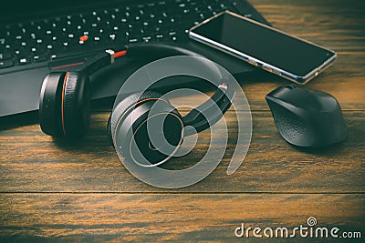 Working place and office desk with laptop, headset, smartphone and computer mouse Stock Photo