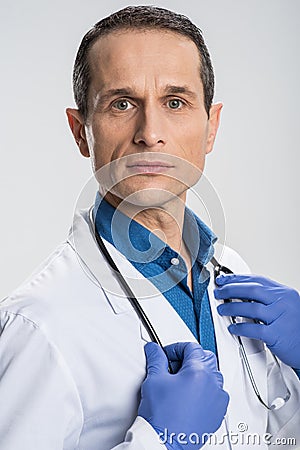 Skillful irresistible male physician ready for achievements Stock Photo