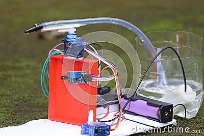 Working prototype of a fire detection and water spraying robot made with microcontroller. Fire fighting mini robot made for Stock Photo