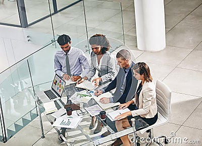 Working side-by-side to achieve success. a group of businesspeople having a meeting. Stock Photo