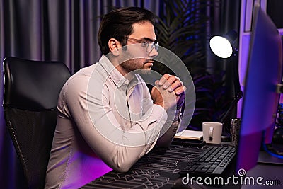 Working smart IT developer analyzing data software development on pc. Surmise. Stock Photo
