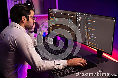 Working smart IT developer analyzing data software development on pc. Surmise. Stock Photo