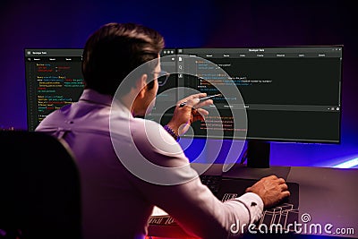 Working smart IT developer pointing data software development on pc. Surmise. Stock Photo