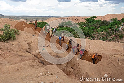 Working in tandem, gems miners united their effort. Ilakaka, Madagascar Editorial Stock Photo