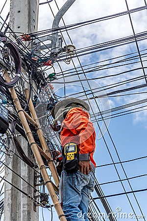 Working to install electric line Editorial Stock Photo