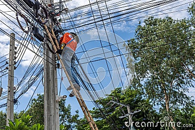 Working to install electric line Editorial Stock Photo