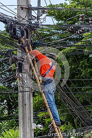 Working to install electric line Editorial Stock Photo