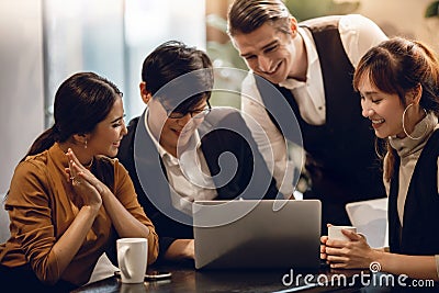 Working Together Concept. Group of Diversity Business People Working on Laptop in Office. Happy Teamwork Group Stock Photo