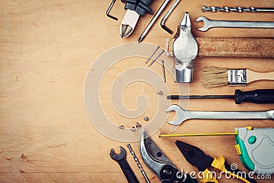 Working tools on wooden rustic background from above Stock Photo