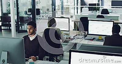 Working towards their personal goals. High angle shot of corporate businesspeople working in their office. Stock Photo