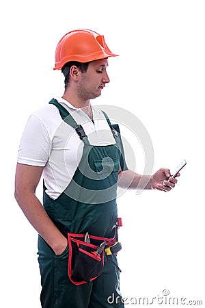 Workman in coverall holding mobile phone isolated on white Stock Photo