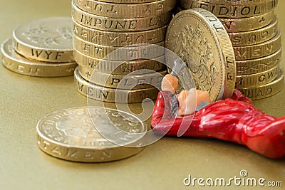 Workman Fixes Pile of British Pound Coins Editorial Stock Photo