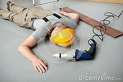 Workman injured at work Stock Photo