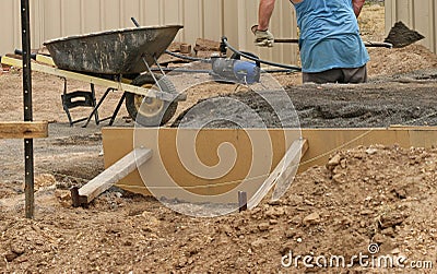 Workman labouring at a building site Stock Photo
