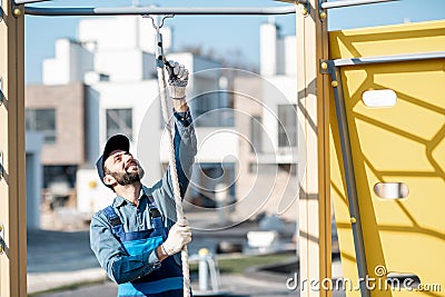 Workman mounting playground Stock Photo