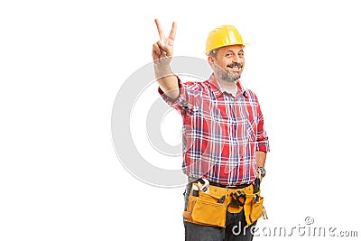 Workman showing peace or victory sign Stock Photo