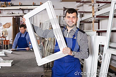 Workman showing PVC manufacturing output Stock Photo