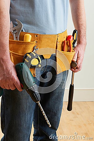 Workman Wearing Toolbelt Stock Photo