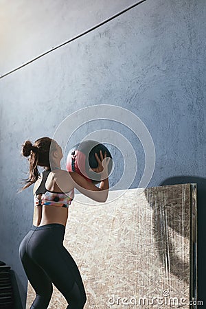 Workout. Sport Woman Training With Crossfit Ball At Gym Stock Photo