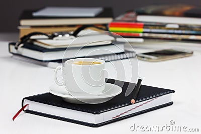 Workplace with business diary, pencil and cup of coffee break Stock Photo