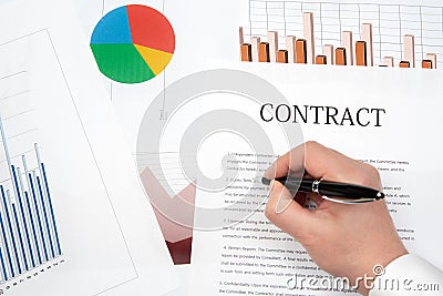 Workplace businessman. Contracts, charts, and graphs on the desk Stock Photo