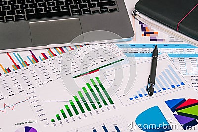 Workplace with a computer and analytical charts, diagrams. Accountant`s calculations, audit and data analysis. Business, Finance Editorial Stock Photo