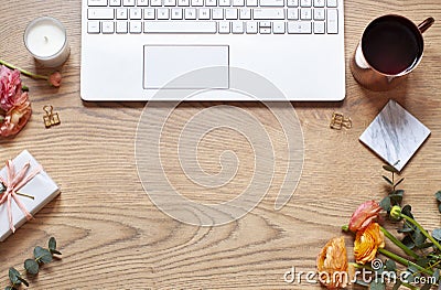 Workplace concept flat lay with a bouquet and a keyboard. Womens day or Mothers day card. Stock Photo