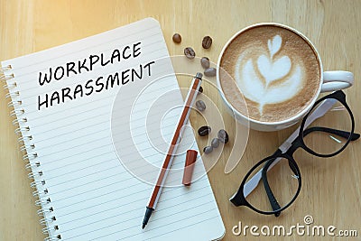 Workplace harassment concept on notebook with glasses, pencil an Stock Photo