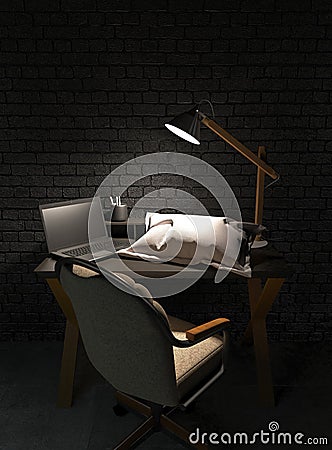 A workplace at night with one office desk, laptop and pillow on a table in a dark room lit by the light of a desk lamp. Heavy Stock Photo