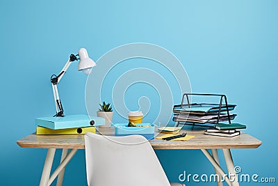 Workplace with papers and lunch box Stock Photo