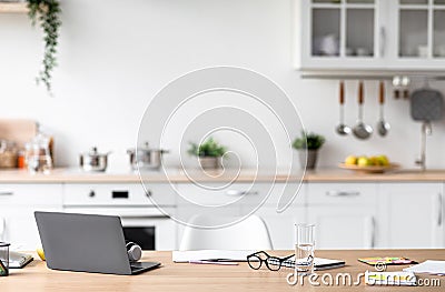 Workplace of student, blogger, manager and businessman, study or work remote in minimalist kitchen interior Stock Photo