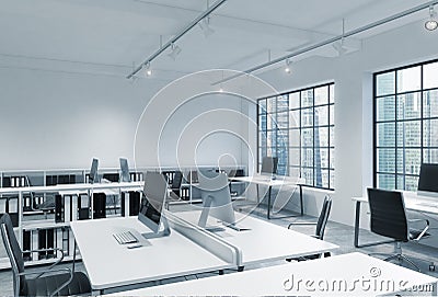Workplaces in a bright modern loft open space office. Tables are equipped with modern computers; book shelves. Singapore panoramic Stock Photo