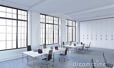 Workplaces in a bright modern open space loft office. Stock Photo