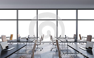 Workplaces in a modern panoramic office, copy space in the windows. Open space. White tables and brown leather chairs. Stock Photo