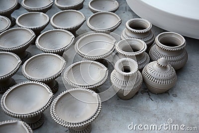 Works on traditional diya oil lamps in Bikaner, India. Stock Photo